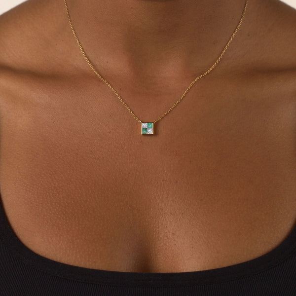 picture of diamond earth sign necklace on body